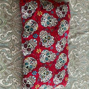 Handmade day of the dead pillow with skulls.